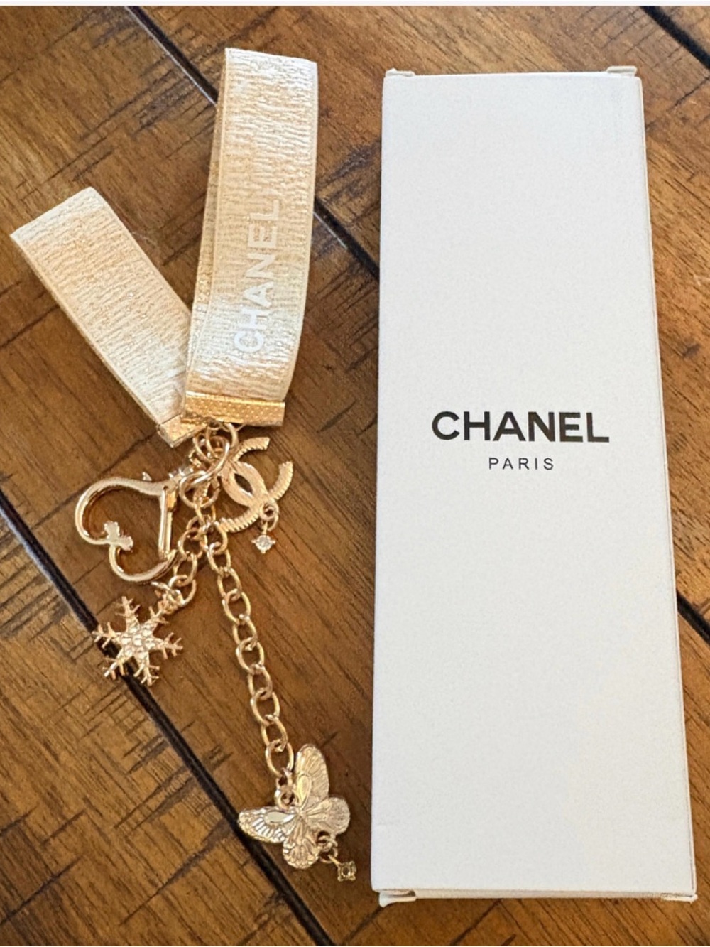 CHANEL Gold Ribbon Charm Keyring with Butterfly & Snowflake